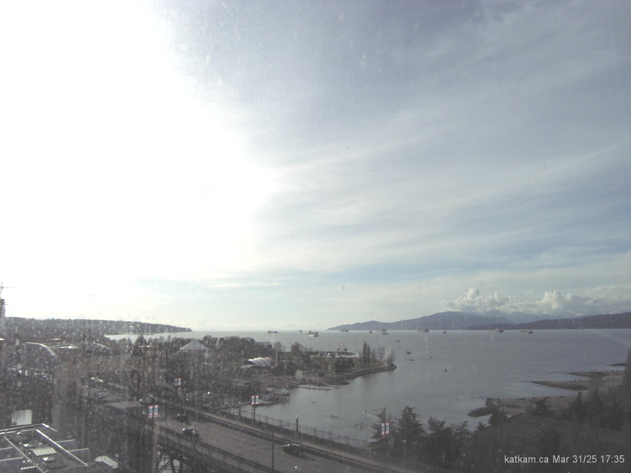 Click for a larger Vancouver BC webcams image facing toward English Bay, the mouth of False Creek and the Burrard Bridge